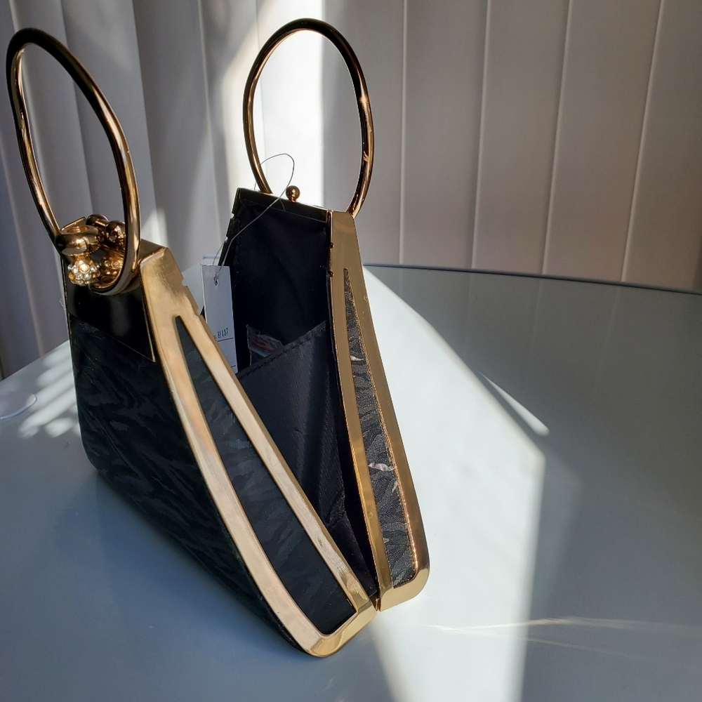 Triangle clutch bag